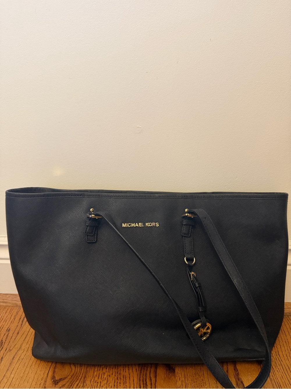 Michael Kors Black Saffiano Leather Tote with Gold Hardware and Laptop Sleeve.